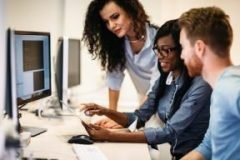 Software engineers working on project and programming in company PEOPLE AT COMPUTER