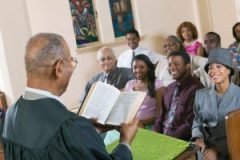 Minister Giving Sermon to congregation in Church back view MINISTRY GIVING SERMON/TEACHING