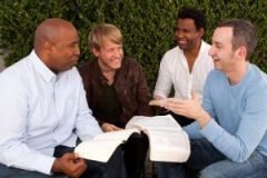 Diverse group of men studying together.
